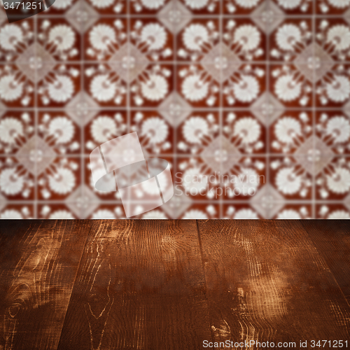 Image of Wood table top and blur vintage ceramic tile pattern wall