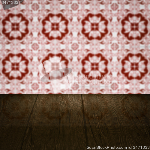 Image of Wood table top and blur vintage ceramic tile pattern wall