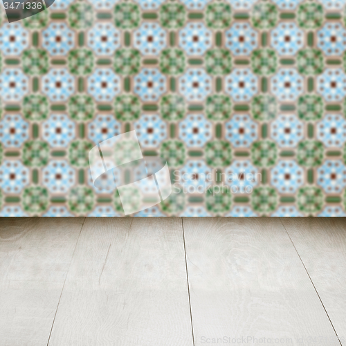 Image of Wood table top and blur vintage ceramic tile pattern wall