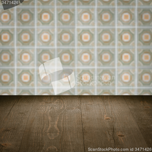Image of Wood table top and blur vintage ceramic tile pattern wall