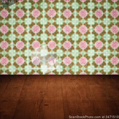 Image of Wood table top and blur vintage ceramic tile pattern wall