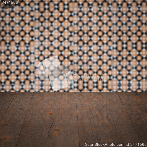 Image of Wood table top and blur vintage ceramic tile pattern wall