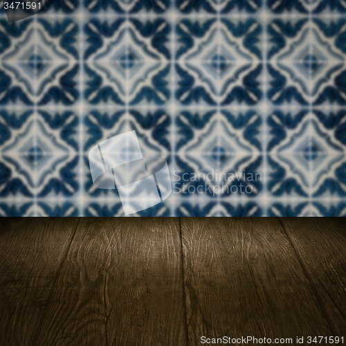 Image of Wood table top and blur vintage ceramic tile pattern wall