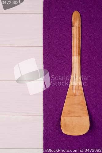 Image of Kitchenware on purple towel