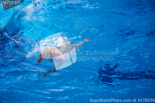 Image of swimmer excercise on indoor swimming poo