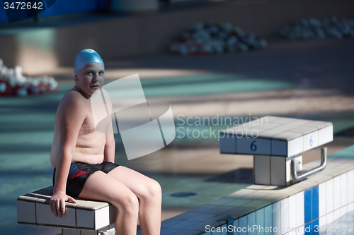 Image of child portrait on swimming pool