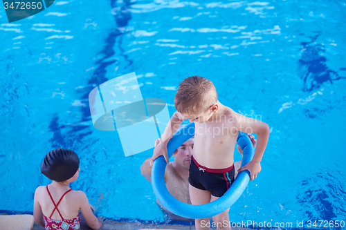 Image of child on swimming poo