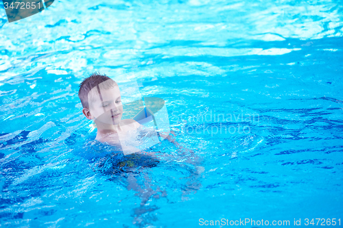 Image of child on swimming poo