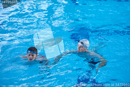 Image of child group  at swimming pool school class