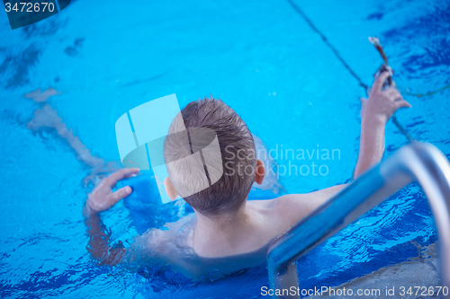 Image of child on swimming poo