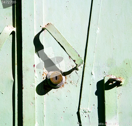 Image of green  metal rusty      morocco in africa the old wood  facade h