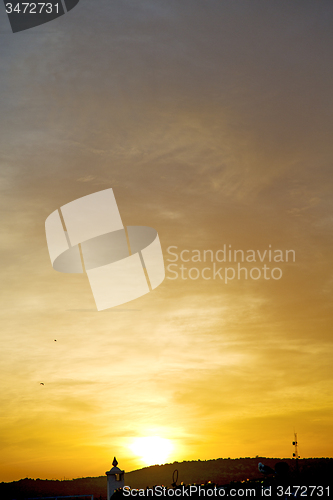 Image of light  the sunrise in  colored sky  abstract background