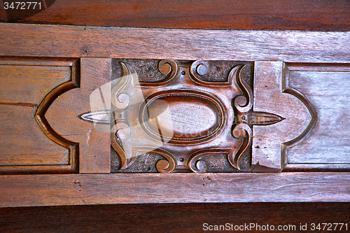 Image of  red abstract  house door    in italy     column   milano       