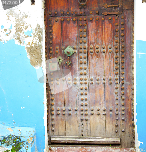 Image of historical blue  in  antique building door morocco      style af