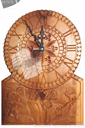 Image of Clock carved on wood