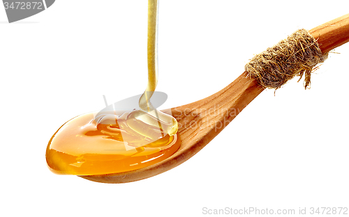 Image of wooden spoon of honey