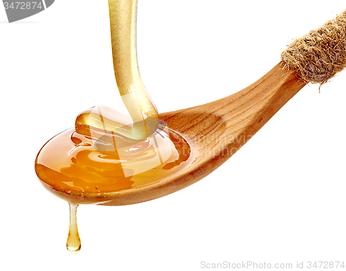 Image of wooden spoon with honey