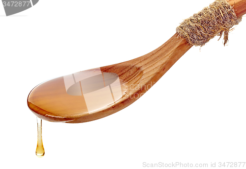 Image of wooden spoon with honey