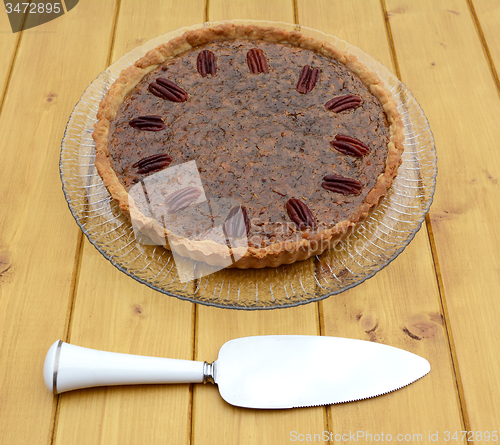 Image of Pie server with pecan pie