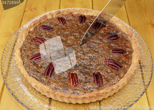 Image of Starting to slice a pecan pie