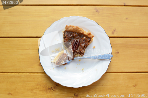 Image of Half-eaten slice of pecan pie