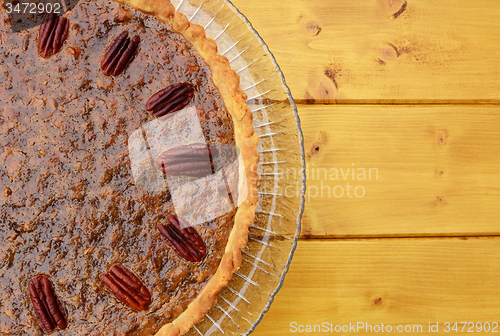 Image of Half pecan pie served on a glass plate