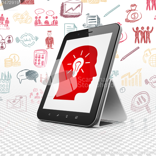 Image of Finance concept: Tablet Computer with Head With Light Bulb on display
