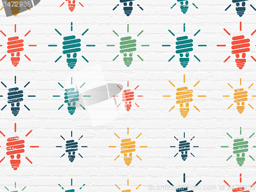 Image of Finance concept: Energy Saving Lamp icons on wall background