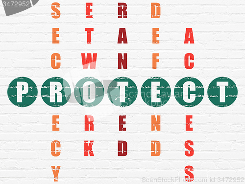 Image of Protection concept: word Protect in solving Crossword Puzzle