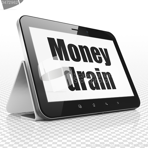 Image of Banking concept: Tablet Computer with Money Drain on display