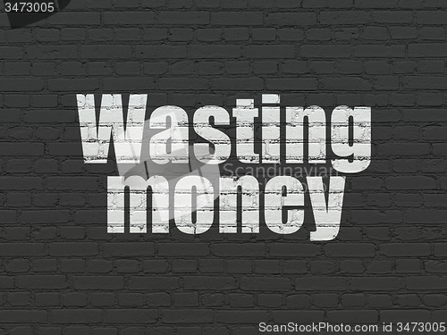 Image of Banking concept: Wasting Money on wall background