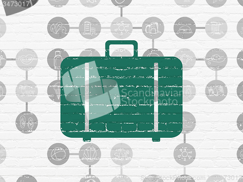 Image of Vacation concept: Bag on wall background