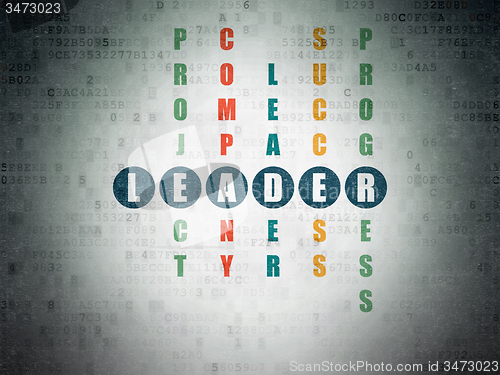 Image of Finance concept: word Leader in solving Crossword Puzzle