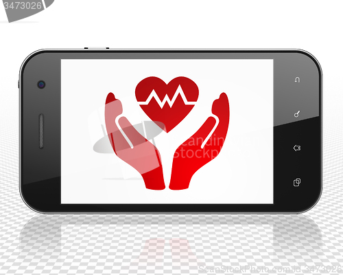 Image of Insurance concept: Smartphone with Health Insurance on display