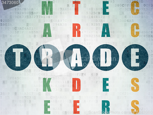 Image of Finance concept: word Trade in solving Crossword Puzzle