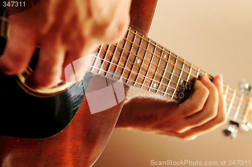 Image of Man playing a guitar