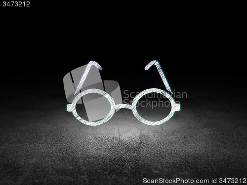 Image of Studying concept: Glasses in grunge dark room