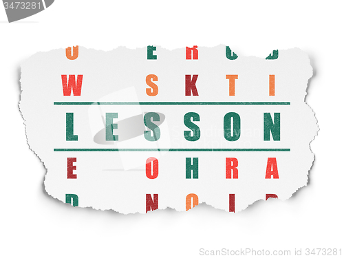 Image of Education concept: word Lesson in solving Crossword Puzzle