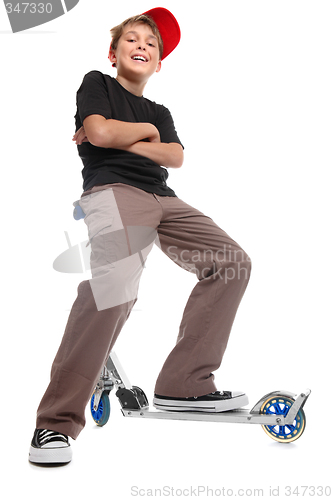 Image of Boy sitting handlebars scooter