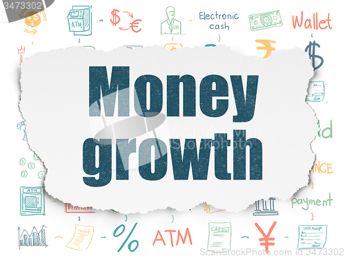 Image of Money concept: Money Growth on Torn Paper background