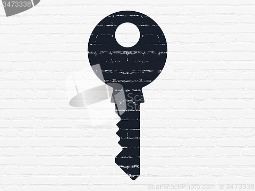 Image of Protection concept: Key on wall background