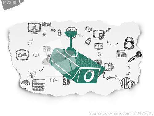 Image of Security concept: Cctv Camera on Torn Paper background
