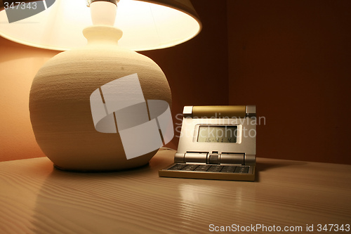 Image of table lamp and a travel clock