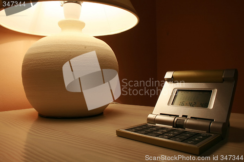 Image of table lamp and a travel clock