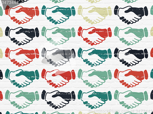 Image of Political concept: Handshake icons on wall background