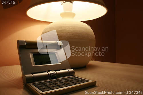 Image of table lamp and a travel clock