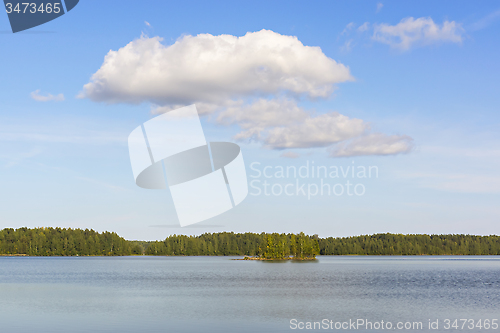 Image of Clouds over wild lake