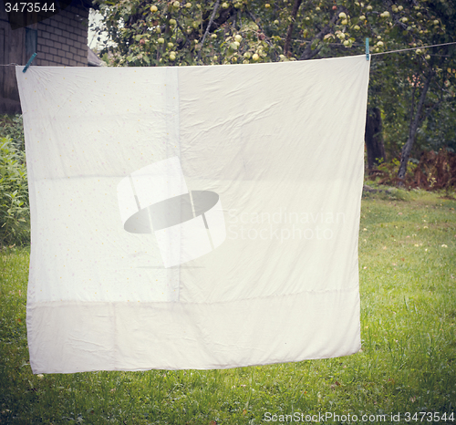 Image of white washed duvet hanging