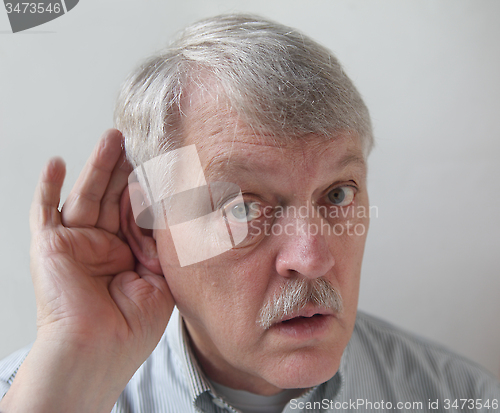 Image of older man is hard of hearing
