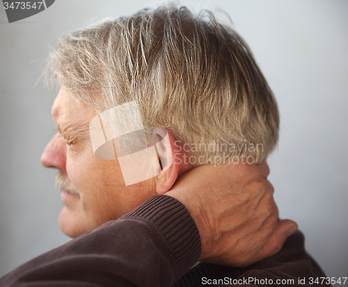 Image of senior man with aching neck